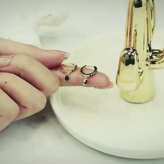 A video showcasing the Black Zircon Teardrop Huggies.