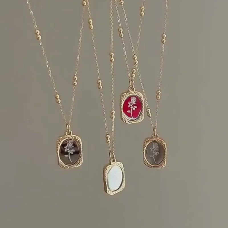 A video showing the Mirrored Birth Flower Gold Necklace.