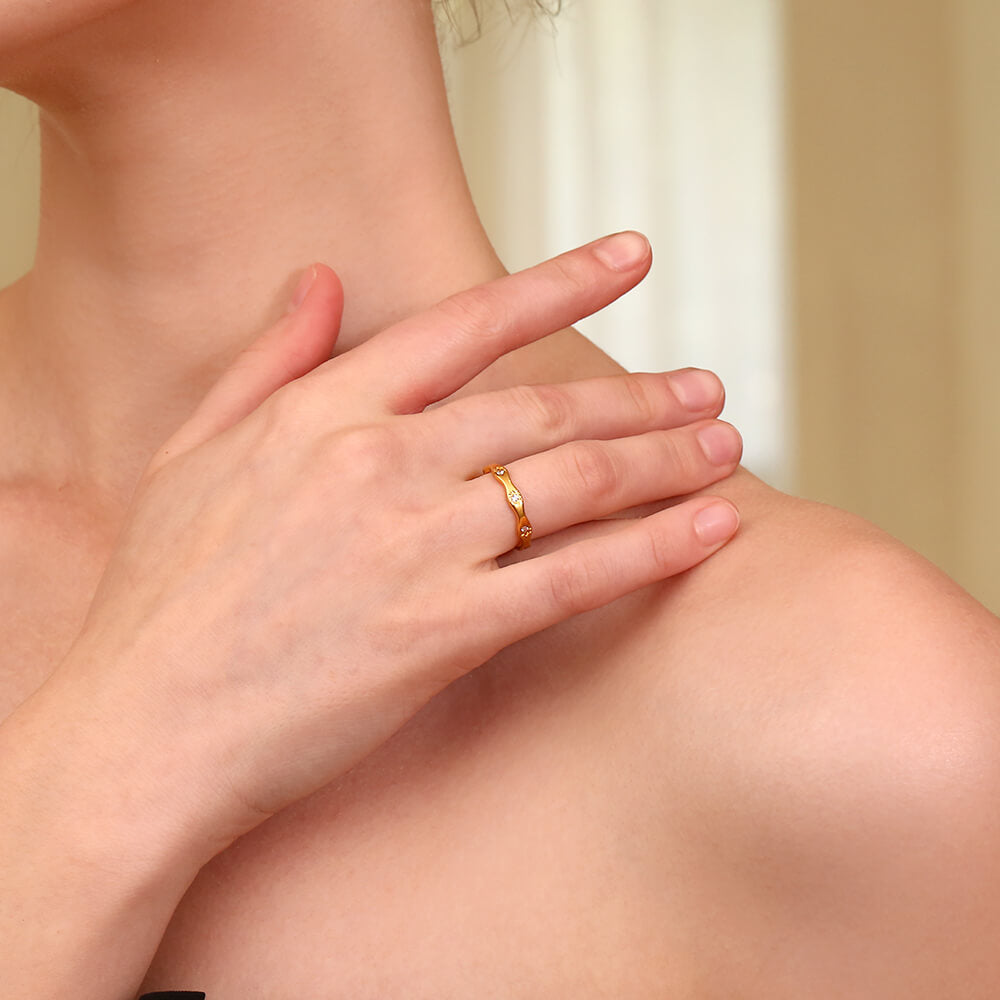 A model wearing the Gold Starburst CZ Ring Band.