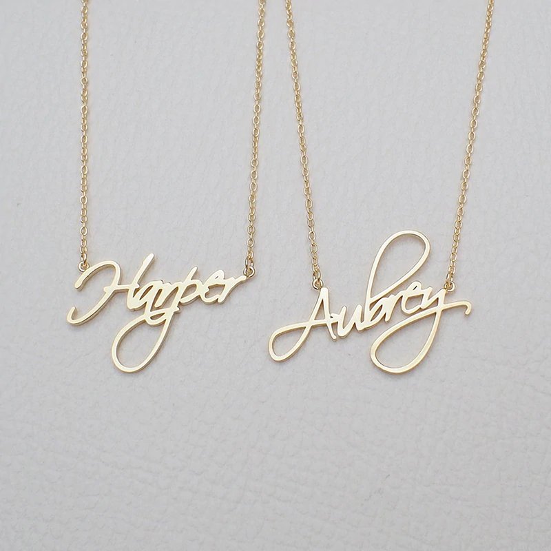 Two name examples in cursive script font custom name necklace.