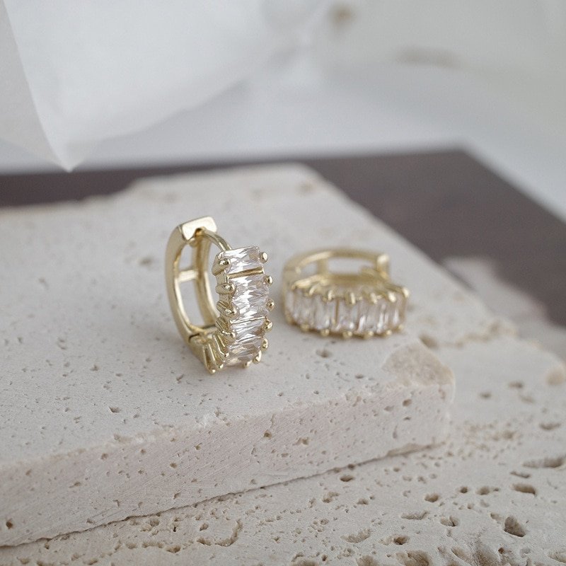 Closeup of the gold CZ Baguette Huggies.