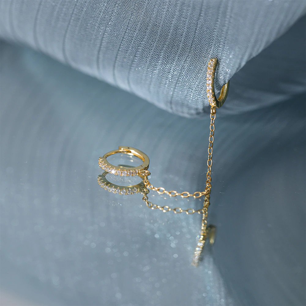 Closeup of the Double Huggie CZ Chain Earring.