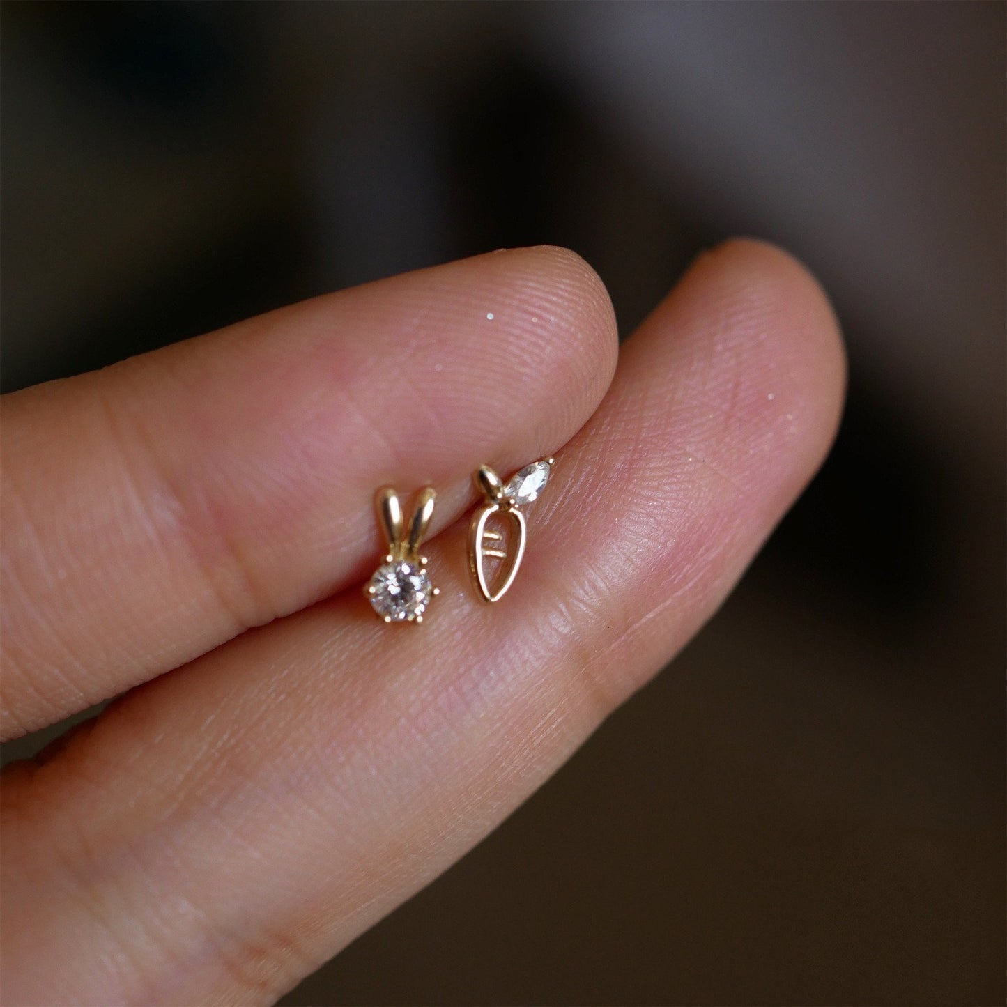 A model holding a rabbit and carrot mix matched stud set.