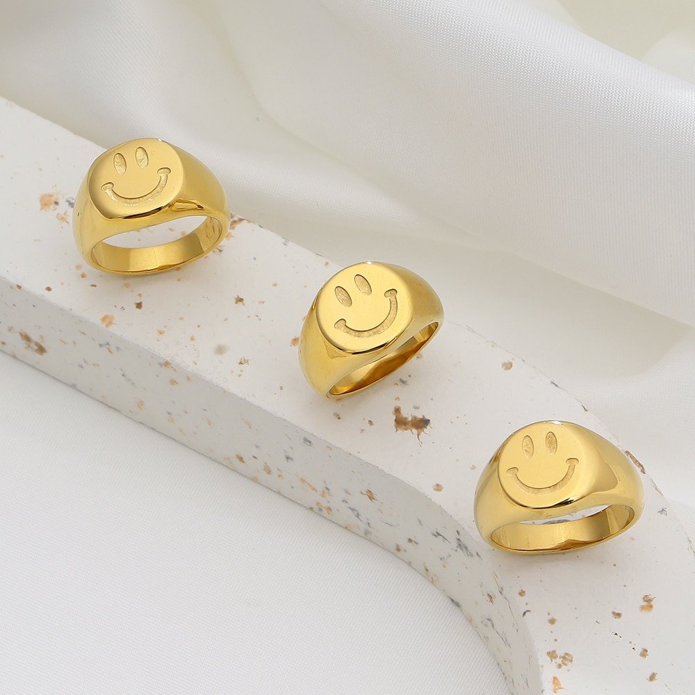 Three Smiley Signet Rings.
