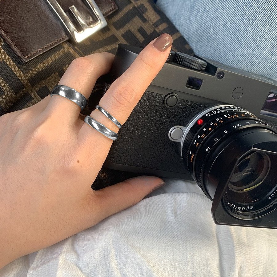 A model wearing silver stacking rings.